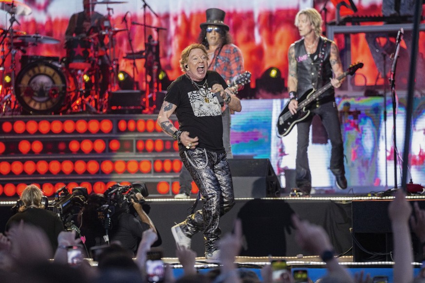 Axl Rose, center, Slash, back left and Duff McKagan, back right of Guns N&#039; Roses perform during the Glastonbury Festival in Worthy Farm, Somerset, England, Saturday, June 24, 2023. (Joel C Ryan/I ...