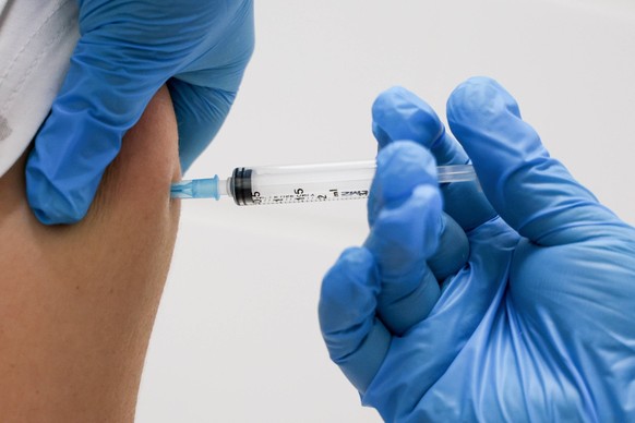 KHIMKI, MOSCOW REGION, RUSSIA AUGUST 5, 2022: A patient receives an injection of the Gam-COVID-Vac vaccine under the brand name of Sputnik V against the novel coronavirus at outpatient clinic No 5. Se ...