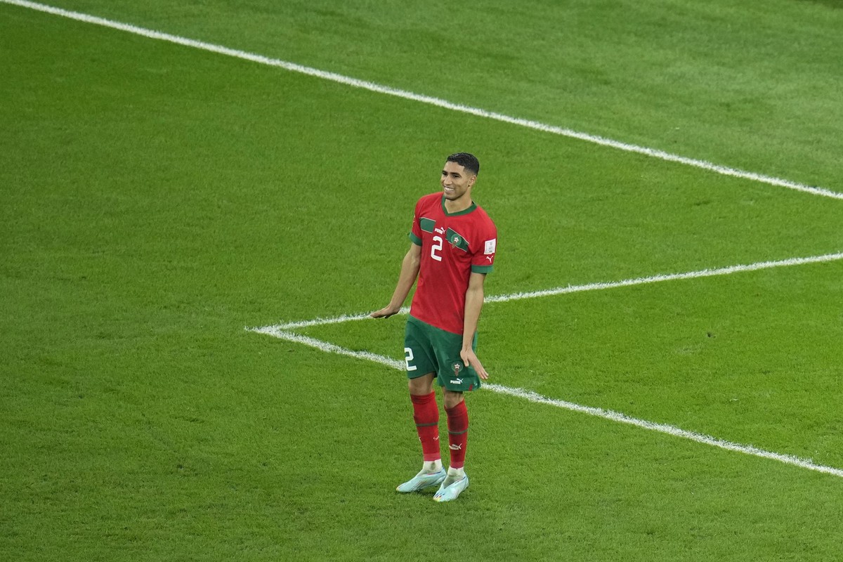 Morocco&#039;s Achraf Hakimi celebrates after he scored the decisive penalty at the end of the World Cup round of 16 soccer match between Morocco and Spain, at the Education City Stadium in Al Rayyan, ...
