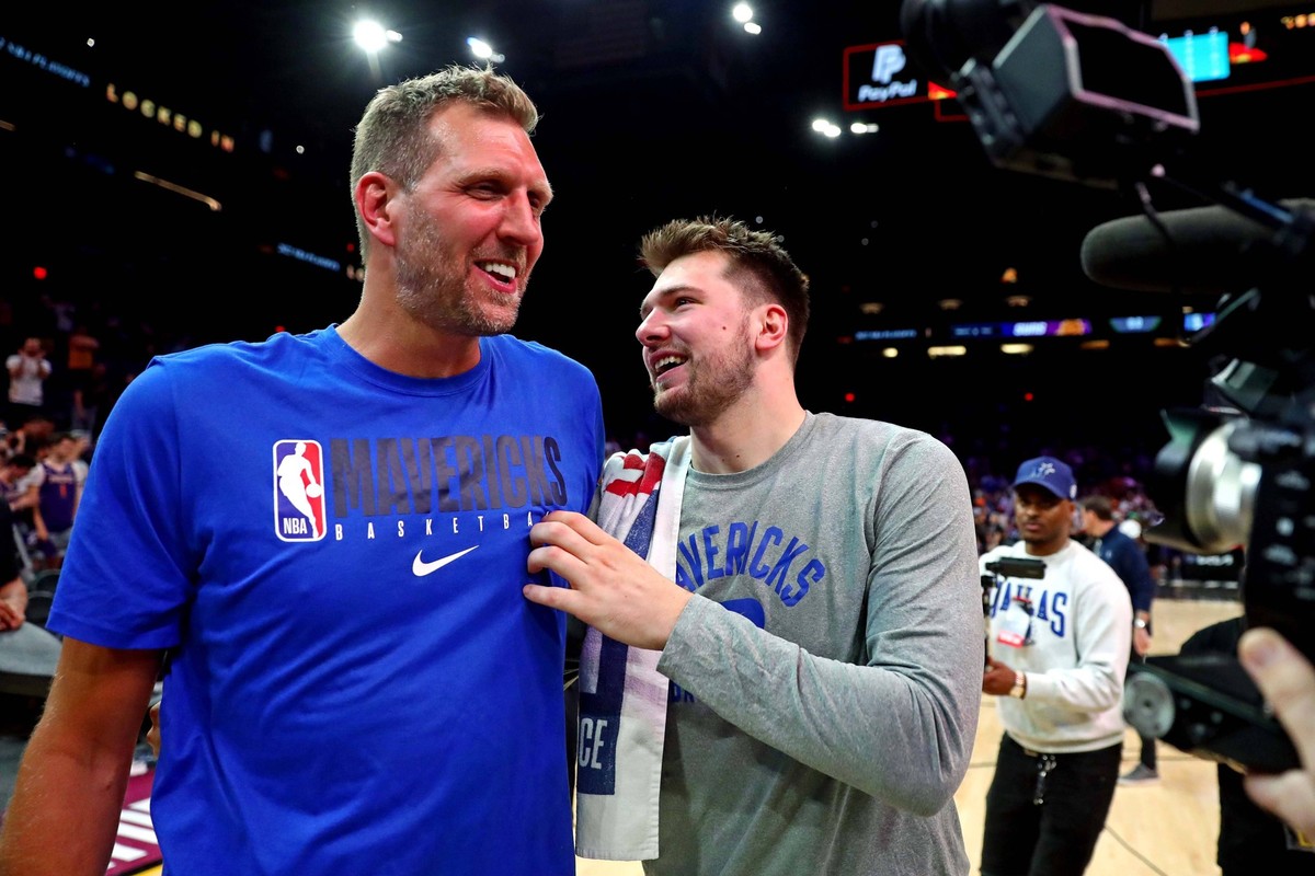 NBA, Basketball Herren, USA Playoffs-Dallas Mavericks at Phoenix Suns, May 15, 2022 Phoenix, Arizona, USA Dallas Mavericks guard Luka Doncic 77 greets former player Dirk Nowitzki after beating the Pho ...