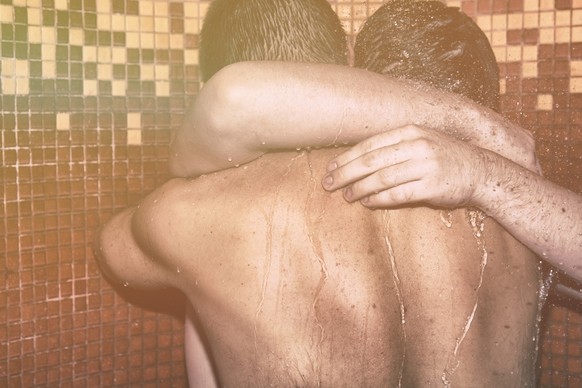Wet body. Men in the shower.