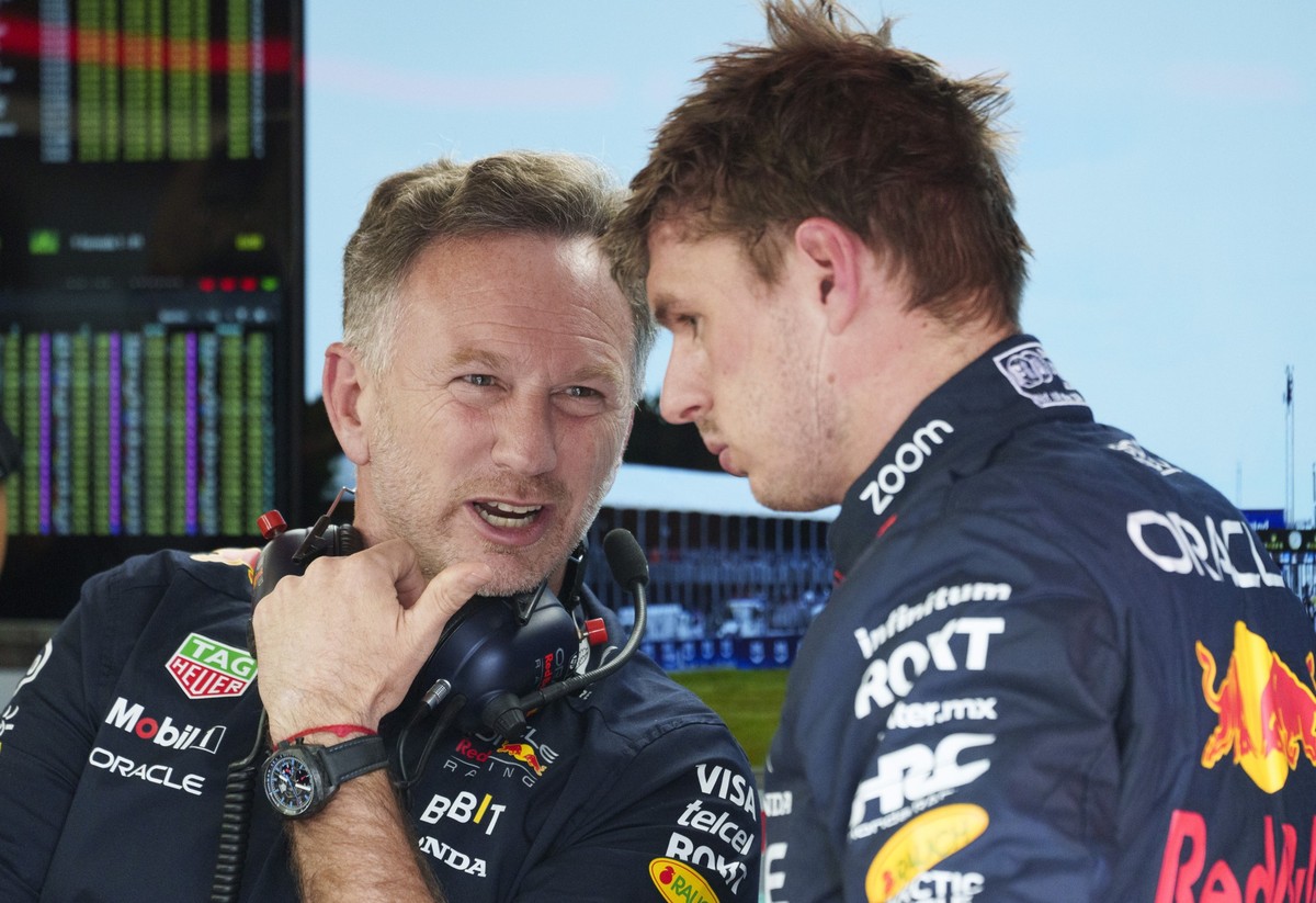 Red Bull Racing team principle Christian Horner chats with driver Max Verstappen of the Netherlands following the third practice session at the Formula 1 Canadian Grand Prix auto race Saturday, June 8 ...