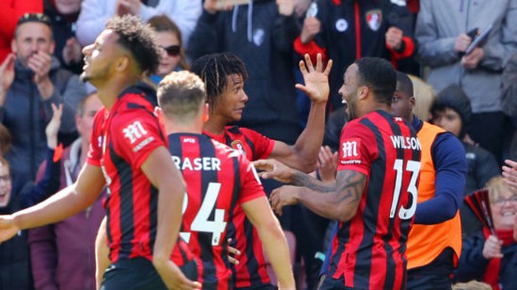 BOURNEMOUTH, ENGLAND - MAY 04: Nathan Ake of AFC Bournemouth celebrates with teammates after scoring his team's first goal during the Premier League match between AFC Bournemouth and Tottenham Hotspur ...