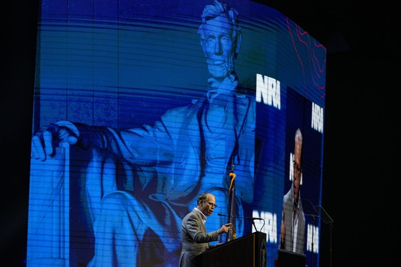 Sen. Mike Braun, R-Ind., speaks at the National Rifle Association Convention in Indianapolis, Friday, April 14, 2023. (AP Photo/Michael Conroy)