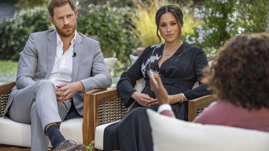 FILE - This image provided by Harpo Productions shows Prince Harry, from left, and Meghan, Duchess of Sussex, in conversation with Oprah Winfrey. Almost as soon as the interview aired, many were quick ...