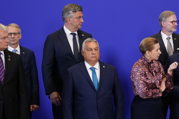 Hungary&#039;s Prime Minister Viktor Orban, centre stands alongside others during a group photo on the second day of the Europe Summit in Granada, Spain, Friday, Oct. 6, 2023. European Union leaders h ...