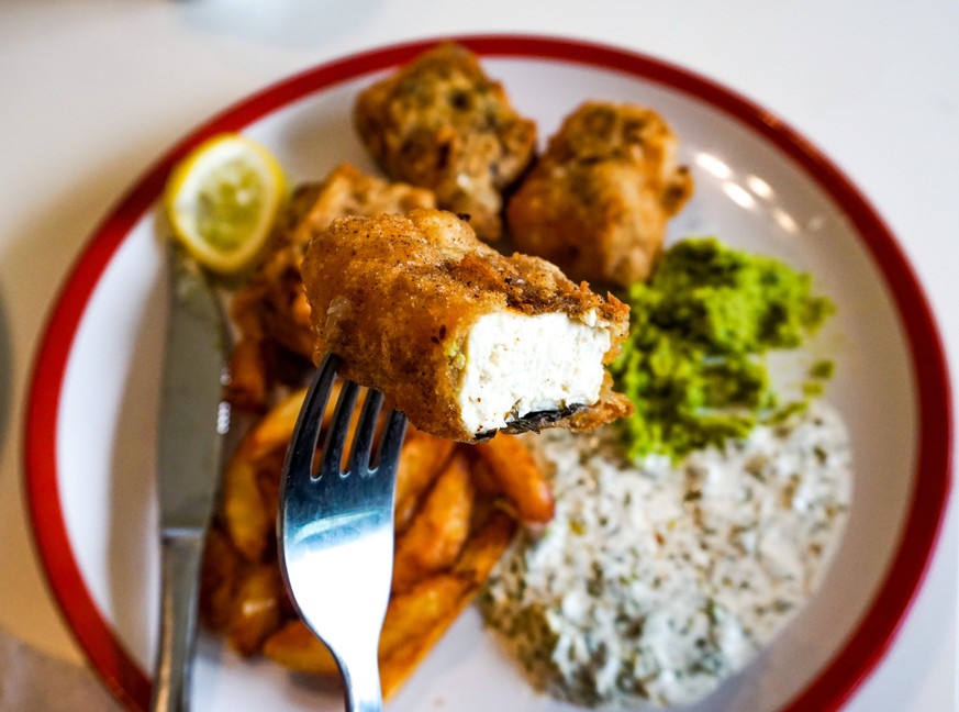 Vegan fish and chips with vegan source, tofu and chips with lemon. heath eating.