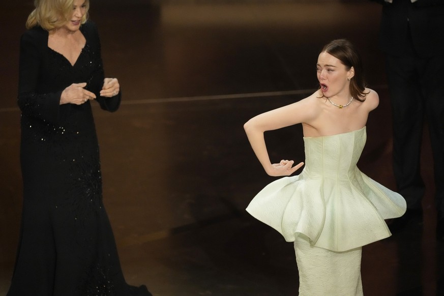 Jessica Lange, left, and Emma Stone appear during the Oscars on Sunday, March 10, 2024, at the Dolby Theatre in Los Angeles. (AP Photo/Chris Pizzello)