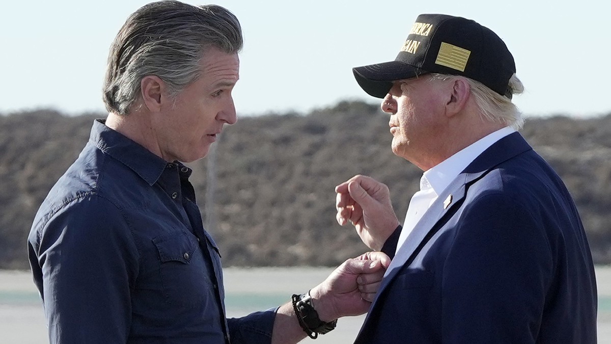 President Donald Trump talks with California Gov. Gavin Newsom after arriving on Air Force One at Los Angeles International Airport in Los Angeles, Friday, Jan. 24, 2025. (AP Photo/Mark Schiefelbein)