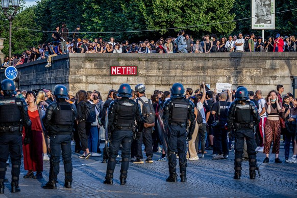 June 30, 2023, Paris, France: Police officers seen standing by as demonstrators protest inside Tuilleries Garden. On the fourth day of protests following the death of 17-year-old Nahel by police in Na ...