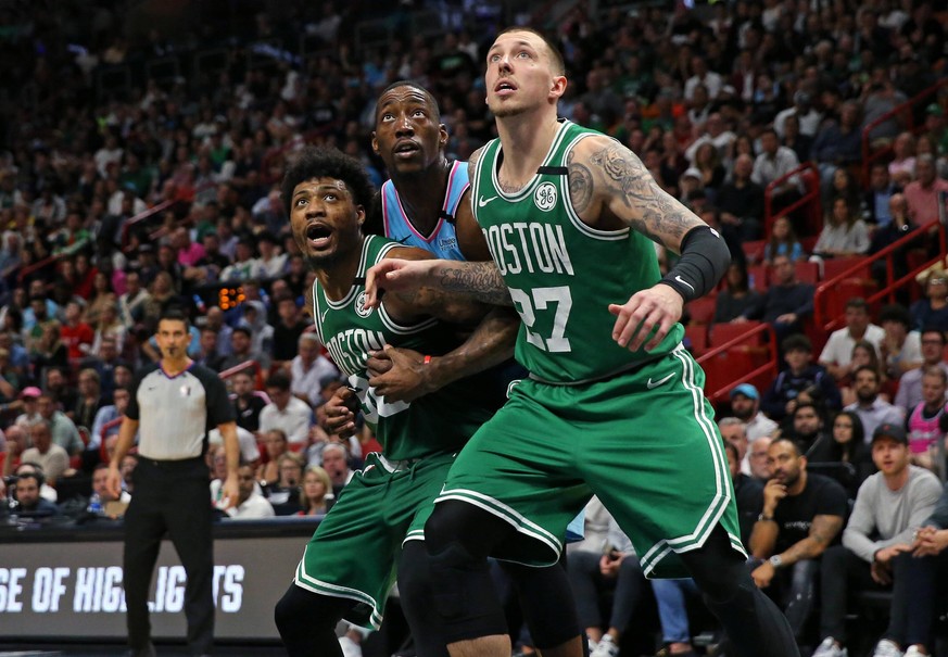 January 28, 2020, Miami, FL, USA: Miami Heat center Bam Adebayo 13 fight for position under the basket against Boston Celtics guard Marcus Smart 36 and Daniel Theis 27 in the fourth quarter of an NBA, ...