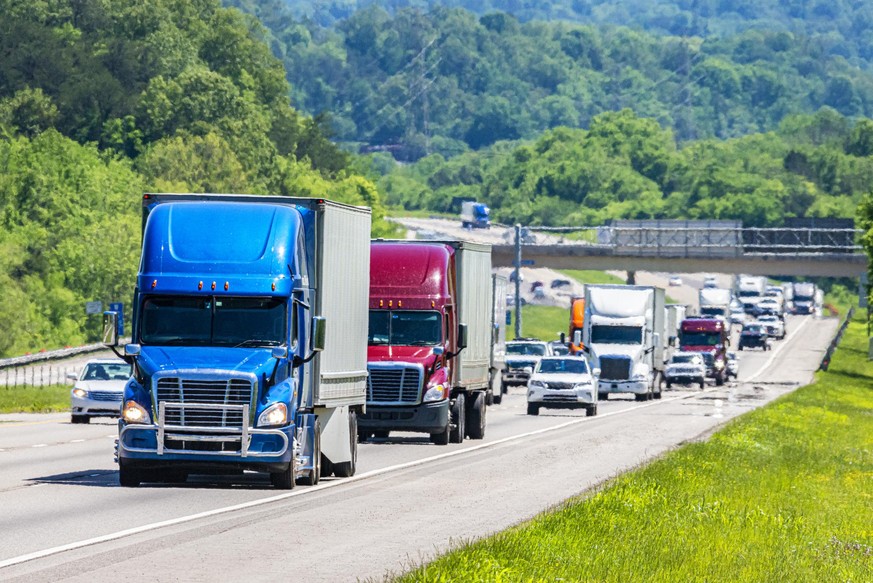 Horizontal shot of heavy traffic on the interstate highway.