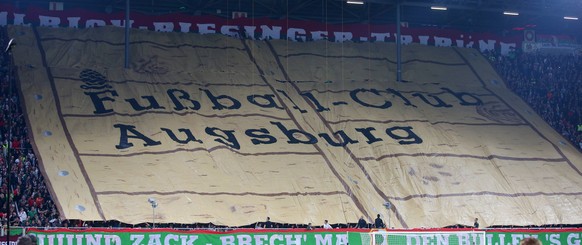 SOCCER - DFB Pokal, Augsburg vs RB Leipzig AUGSBURG,GERMANY,02.APR.19 - SOCCER - DFB Pokal, quarterfinal, FC Augsburg vs RasenBallsport Leipzig. Image shows fans of FC Augsburg. Keywords: banner. PUBL ...