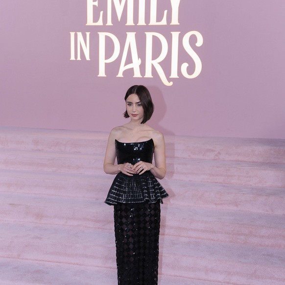 August 14, 2024, Hollywood, California, USA: Lily Collins on the red carpet of the Premiere of Netflix s Emily In Paris Season 4 Part 1 on Wednesday August 14, 2024 at the Egyptian Theater in Hollywoo ...