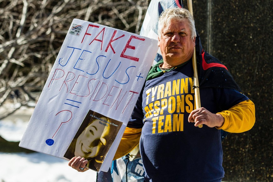 February 1, 2021, Carson, Nevada, United States: A Qanon believer holds a placard during the demonstration..Protesters gathered at the state s legislative building to protest various causes such as th ...