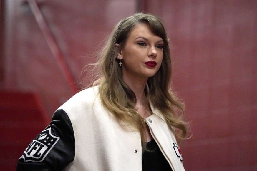 FILE - Taylor Swift enters Arrowhead Stadium before the start of an NFL football game between the Kansas City Chiefs and the Cincinnati Bengals, Dec. 31, 2023, in Kansas City, Mo. A man charged with s ...