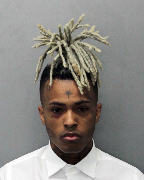 This 2017 arrest photo made available by the Miami Dade Dept. of Corrections shows Jahseh Onfroy, also known as the rapper XXXTentacion, under arrest. Onfroy was shot and killed, Monday, June 18, 2018 ...