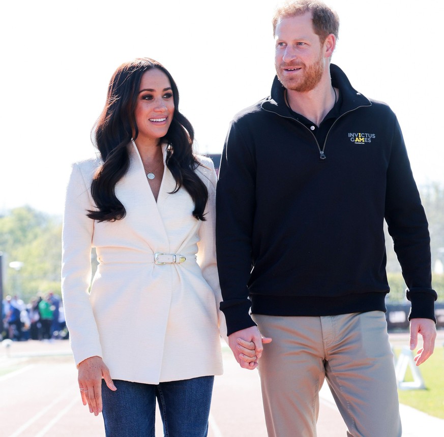 THE HAGUE, NETHERLANDS - APRIL 17: Prince Harry, Duke of Sussex and Meghan, Duchess of Sussex attend the Athletics Competion during day two of the Invictus Games The Hague 2020 at Zuiderpark on April  ...