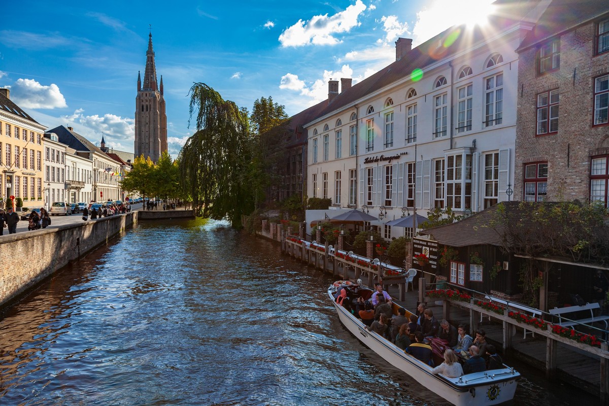 Bruges, Belgium, August 21 2014, Tourists on a sight seeing boat trip on the Brugge Zeebrugge Canal Model Released Property Released xkwx Bruges Brugge Belgium sightseeing boat canal Brugge Zeebrugge  ...