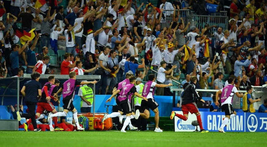 Soccer Football - World Cup - Group F - Germany vs Sweden - Fisht Stadium, Sochi, Russia - June 23, 2018 Germany substitutes and coach Joachim Low celebrate after Toni Kroos (not pictured) scored thei ...