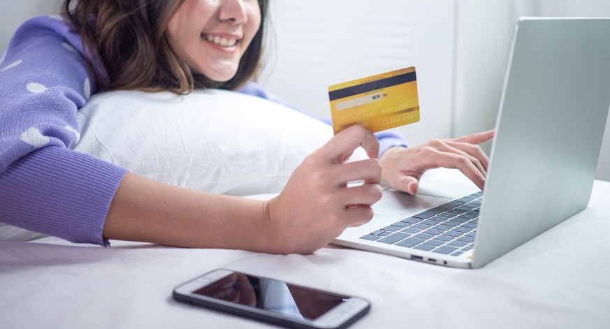 Women are happy to use credit cards to shop online during promotions. payment online concept