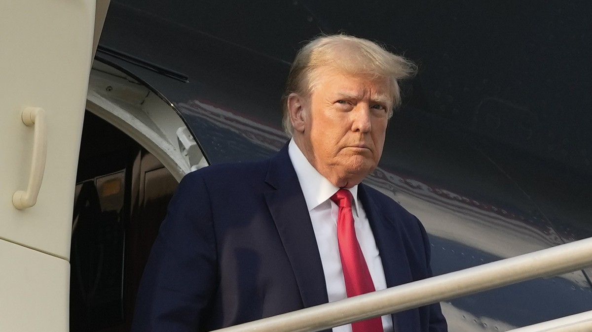 FILE - Former President Donald Trump steps off his plane as he arrives at Hartsfield-Jackson Atlanta International Airport, Thursday, Aug. 24, 2023, in Atlanta. (AP Photo/Alex Brandon, File)