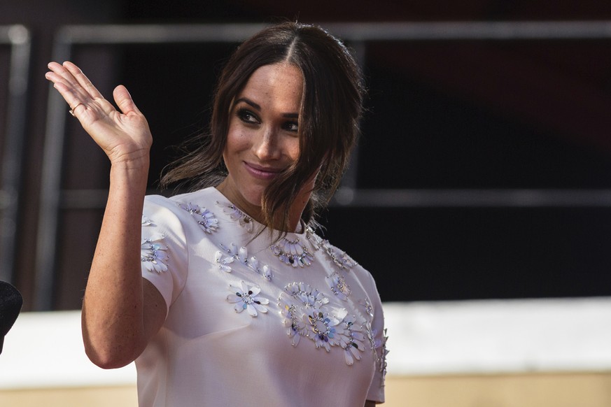 FILE - Meghan Markle, Duchess of Sussex, salutes during the Global Citizen festival, on Sept. 25, 2021 in New York. A British newspaper publisher began Tuesday its court appeal against a judge's rulin ...