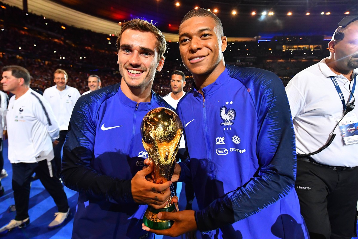September 9, 2018 - Paris, France - Kylian Mbappe, Atoine Griezmann of France celebrate with the World Cup Trophy after the UEFA Nations League A group official match between France and Netherlands at ...