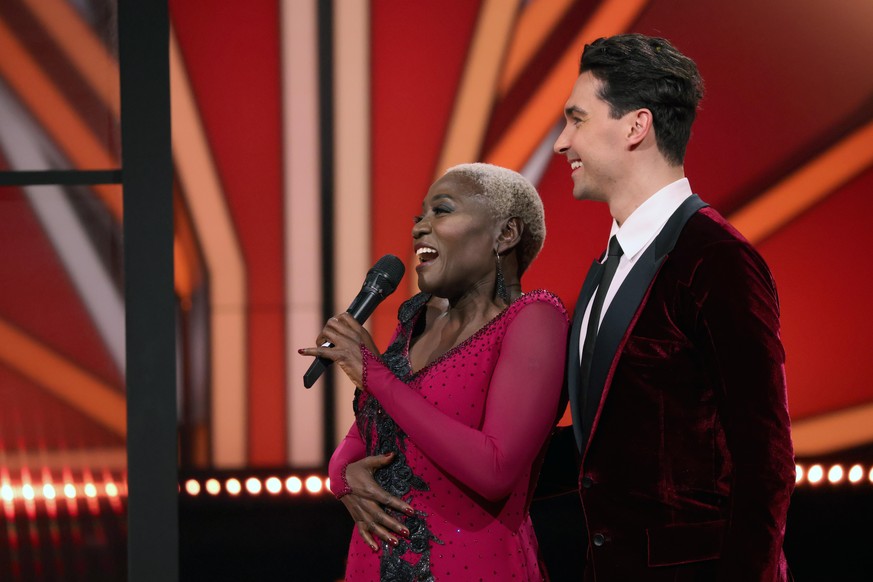 COLOGNE, GERMANY - MARCH 05: Auma Obama and Andrzej Cibis talk to the jury after their performance on stage during the 1st show of the 14th season of the television competition &quot;Let&#039;s Dance& ...