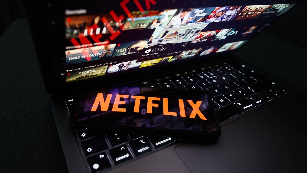 Popular Streaming Services Photo Illustrations Netflix logo displayed on a phone screen and Netflix website displayed on a laptop screen are seen in this illustration photo taken in Krakow, Poland on ...