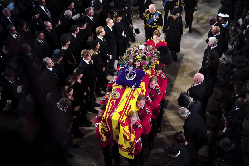 King Charles III and the Queen Consort follow the coffin during the Committal Service for Queen Elizabeth II at St George&#039;s Chapel, at Windsor Castle, Windsor, England, Monday Sept. 19, 2022. The ...