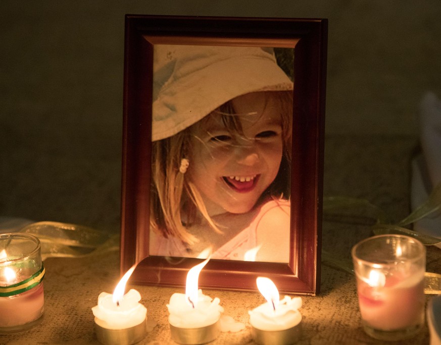 Madeleine McCann anniversary. Candles are placed next to a photo of Madeleine McCann inside the Church of Nossa Senhora da Luz in Praia Da Luz, Portugal, where a special service was held to mark the 1 ...