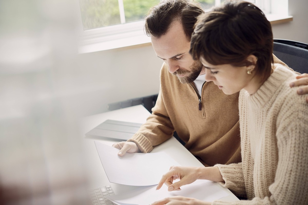 Couple working on bills together in a home office in London model released, Symbolfoto property released, PWF01380