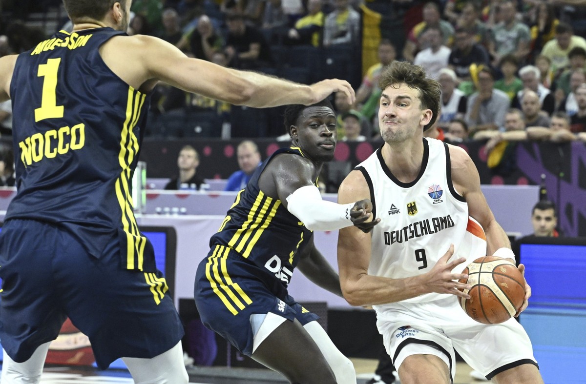 Sweden&#039;s Denzel Andersson, left, and Barra Njie with Germany&#039;s Franz Wagner during Eurobasket, European Basketball Championship group B match between Germany and Sweden in Tampere, Finland,  ...