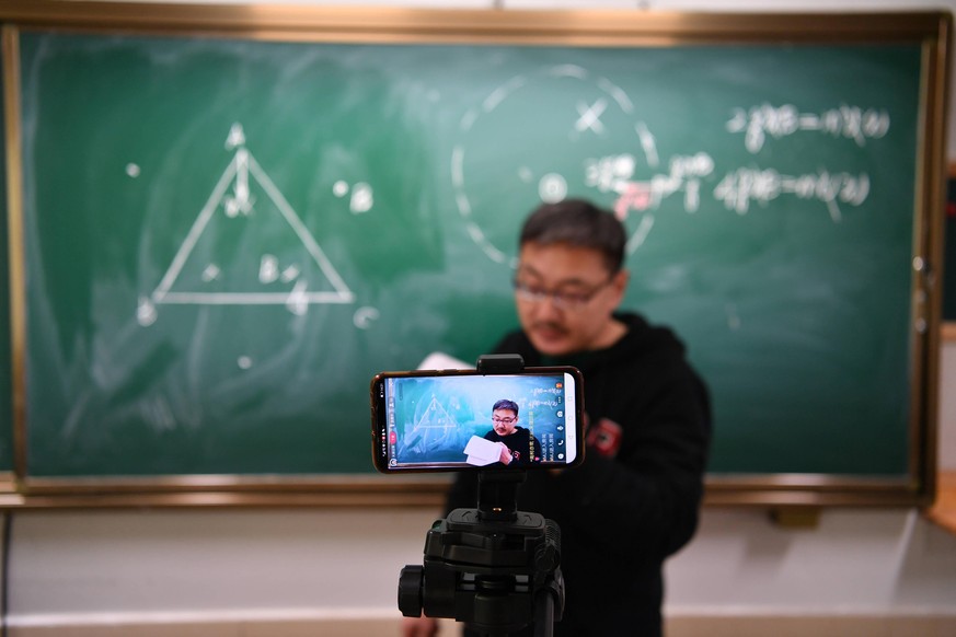 January 19, 2021, Changchun, Jilin, China: A teach is teaching math online for the senior students in an empty classroom in Changchun,Jilin,China on 19th January, 2021. Changchun China - ZUMAt151 2021 ...