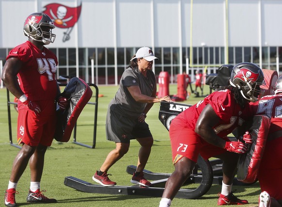 Tampa Bay Buccaneers assistant defensive line coach Lori Locust runs drills while standing on the sled during mandatory mini-camp on June 5, 2019 at the AdventHealth Training Center in Tampa, Fla. (Di ...