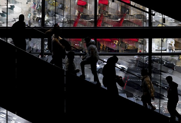 FILE - Shoppers walk up and down the stairs at a Nike store on Black Friday, Nov. 25, 2022, in New York.  Mistakes during the holiday season can be detrimental to a company's bottom line, but small b...