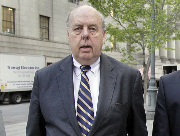 FILE - In this April 29, 20111, file photo, attorney John Dowd walks in New York. Dowd, President Donald Trump&#039;s lead lawyer in the Russia investigation has left the legal team, is confirming his ...