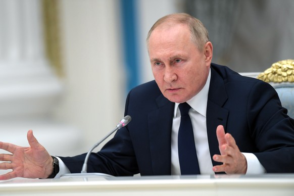 Russian President Vladimir Putin gestures as he speaks to members of the State Duma and the Federal Assembly of The Russian Federation in the Kremlin in Moscow, Russia, Thursday, July 7, 2022. (Alexei ...