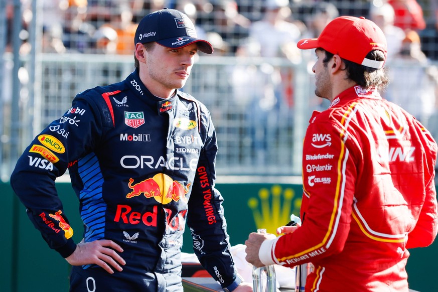 March 23, 2024, Melbourne, Victoria, Australia: Max Verstappen of the Netherlands and Oracle Red Bull Racing with Carlos Sainz of Scuderia Ferrari after qualifying in the 2024 Australian Grand Prix at ...