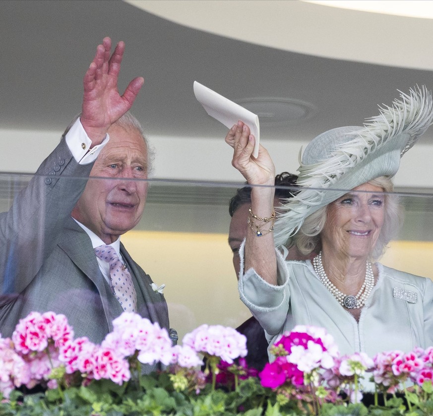 . 22/06/2023. Ascot , United Kingdom. An emotional King Charles III and Queen Camilla after their horse Desert Hero wins The King George V Stakes during Ladies Day on day three of Royal Ascot, United  ...