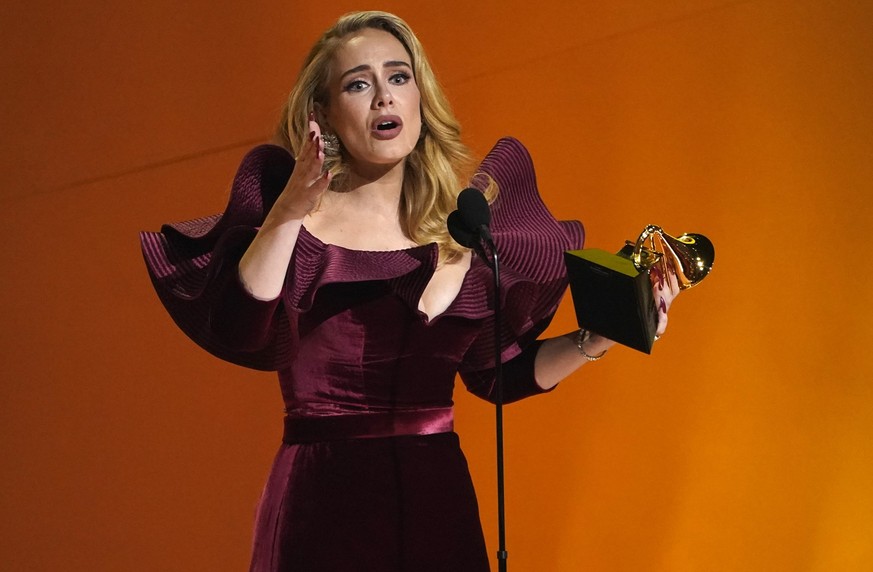 Adele accepts the award for best pop solo performance for &quot;Easy On Me&quot; at the 65th annual Grammy Awards on Sunday, Feb. 5, 2023, in Los Angeles. (AP Photo/Chris Pizzello)