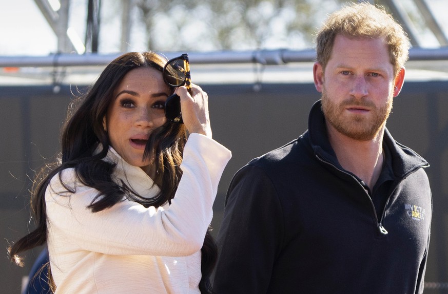 FILE - Prince Harry and Meghan Markle, Duke and Duchess of Sussex visit the track and field event at the Invictus Games in The Hague, Netherlands, Sunday, April 17, 2022. The production company founde ...