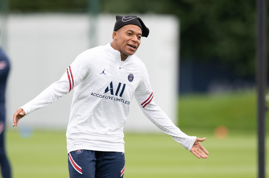 Paris Saint-Germain&#039;s French forward Kylian Mbappe attends a training session at the Camp des Loges Paris Saint-Germain football club&#039;s training ground in Saint-Germain-en-Laye, near Paris,  ...