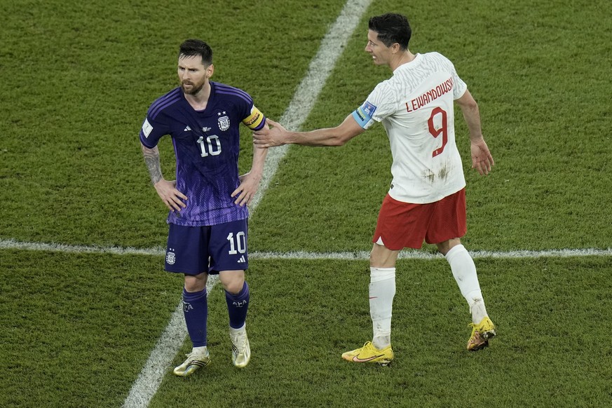 Poland&#039;s Robert Lewandowski, right, interacts with Argentina&#039;s Lionel Messi at the end of the World Cup group C soccer match between Poland and Argentina at the Stadium 974 in Doha, Qatar, W ...