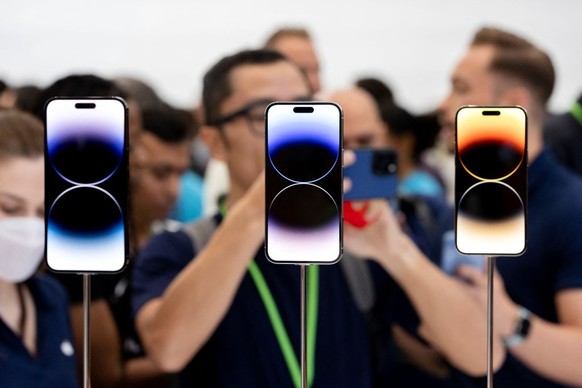 The new iPhone 14 Pros and 14 Pro Max are on display at an Apple event at Apple Park in Cupertino, California, on September 7, 2022. - Apple unveiled several new products including a new iPhone 14, iP ...