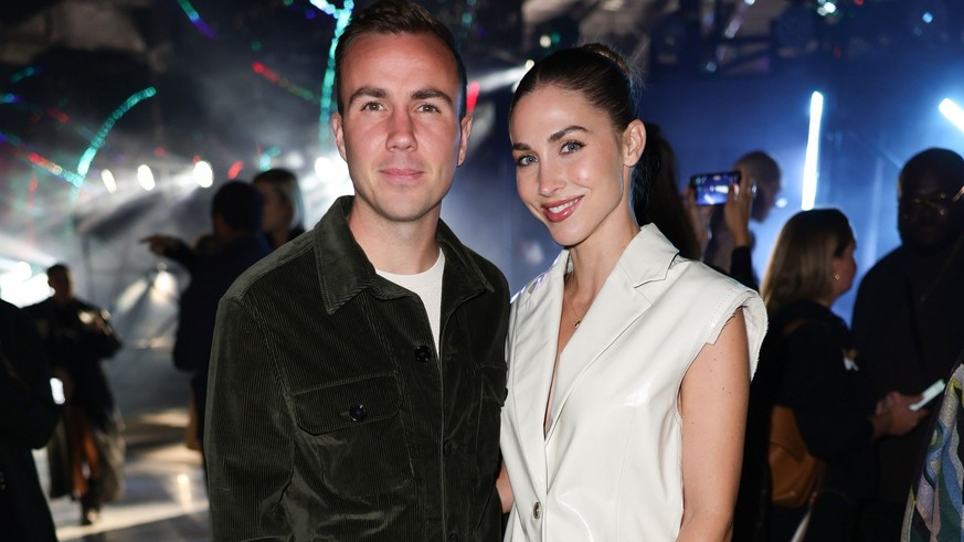 MILAN, ITALY - SEPTEMBER 22: Mario Götze and Ann-Kathrin Götze are seen at the Boss Fashion Show during the Milan Fashion Week Womenswear Spring/Summer 2023 on September 22, 2022 in Milan, Italy. (Pho ...
