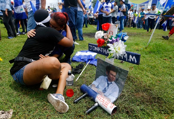 Demonstrators embrace near a memorial for university student Jonathan Morales during a march called &quot;Together we are a volcano&quot; against Nicaragua&#039;s President Daniel Ortega&#039;s govern ...