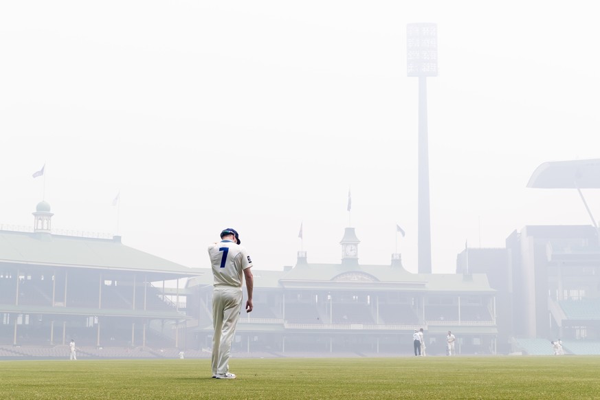 CRICKET SHIELD NSW QLD, Liam Hatcher of the Blues in the outfield on bushfire haze day during day 3 of the Sheffield Shield cricket match between New South Wales and Queensland at the SCG in Sydney, T ...