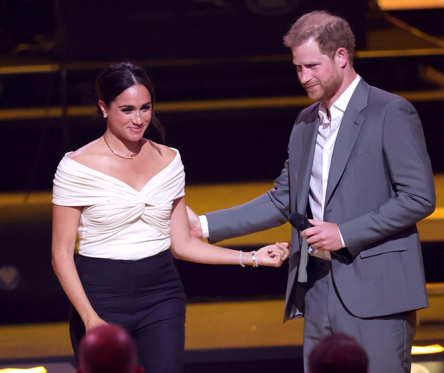 THE HAGUE, NETHERLANDS - APRIL 16: Prince Harry, Duke of Sussex and Meghan, Duchess of Sussex on stage during the Invictus Games The Hague 2020 Opening Ceremony at Zuiderpark on April 16, 2022 in The  ...